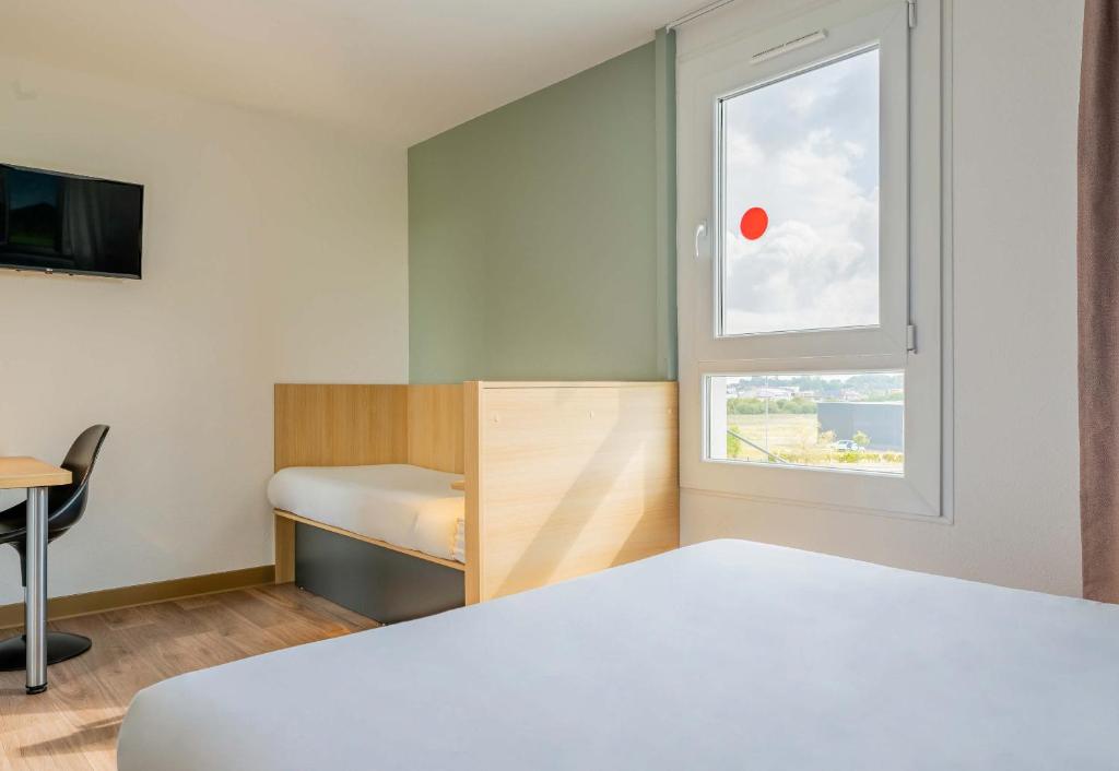 Postel nebo postele na pokoji v ubytování B&B HOTEL Béthune Bruay-la-Buissière