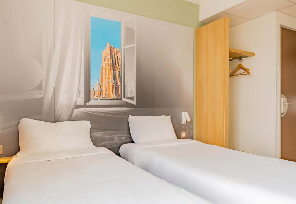 Postel nebo postele na pokoji v ubytování B&B HOTEL Béthune Bruay-la-Buissière