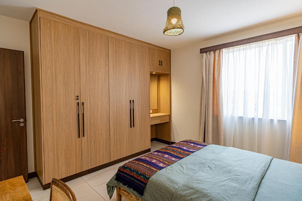 Postel nebo postele na pokoji v ubytování Silvermist Two & Three Bedrooms Wonderiss Homes Westland Living with close proximity to UN, Karura forest & Sarit Mall