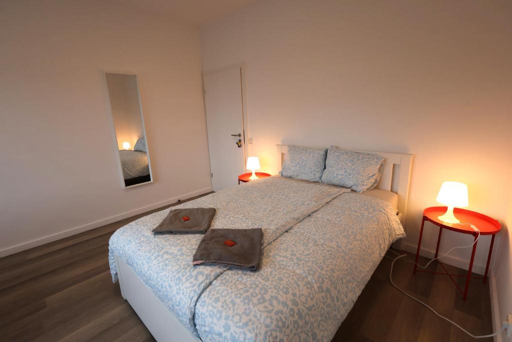a bedroom with a bed with two pillows on it at Luxembourg city center stay in Luxembourg