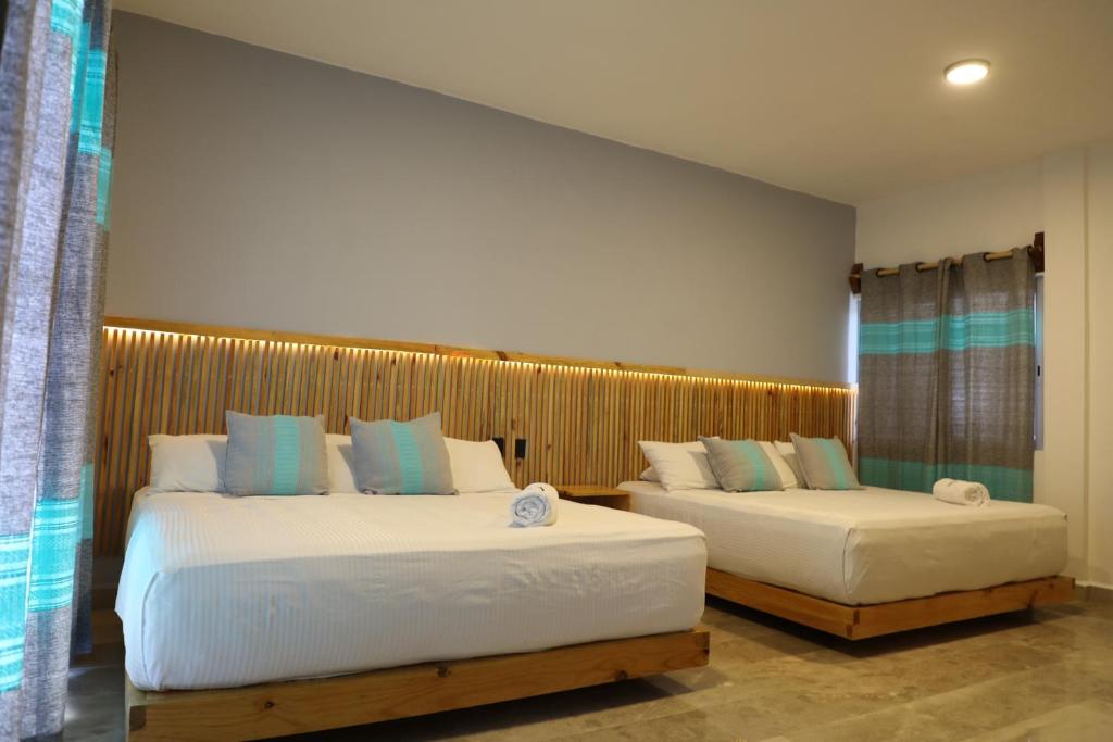 Postel nebo postele na pokoji v ubytování Hotel Playa Zipolite