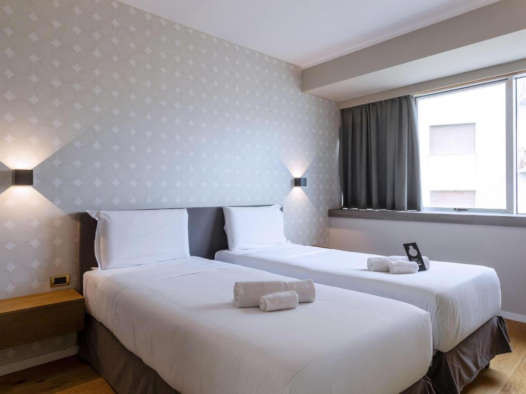 Posteľ alebo postele v izbe v ubytovaní B&B HOTEL Trapani Crystal