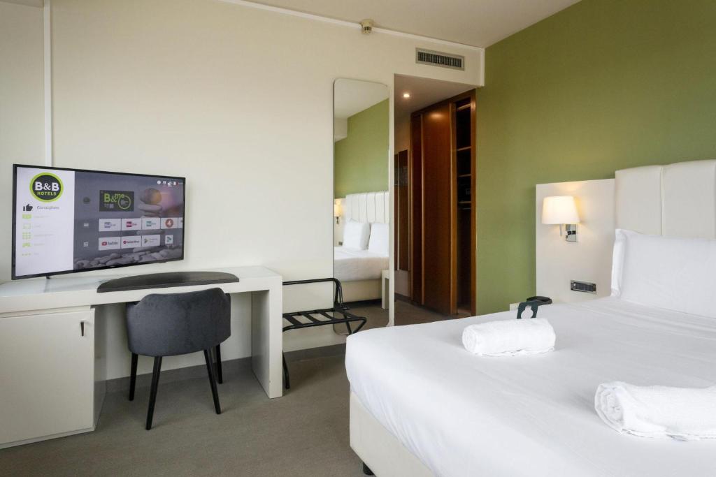 Posteľ alebo postele v izbe v ubytovaní B&B HOTEL Trapani Crystal