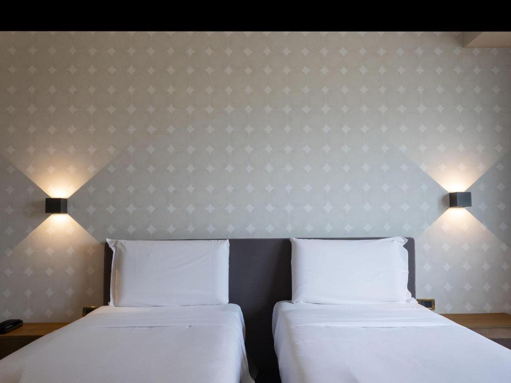 Posteľ alebo postele v izbe v ubytovaní B&B HOTEL Trapani Crystal