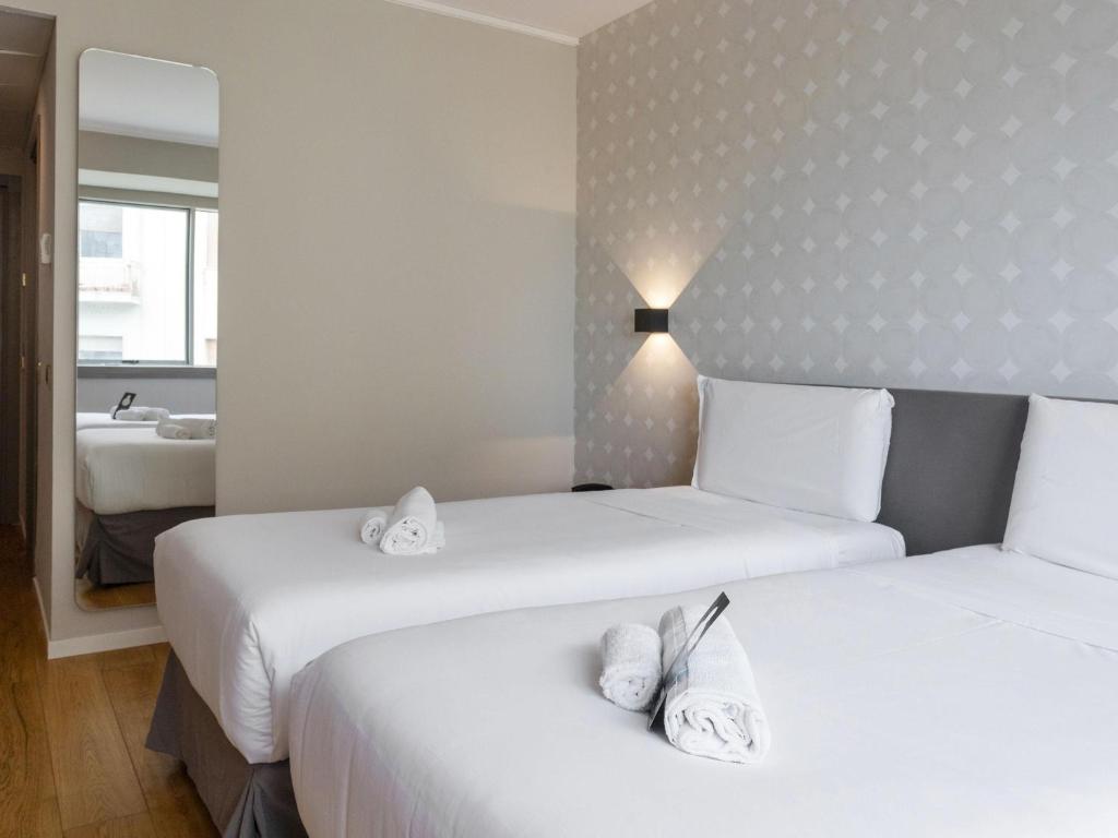 Posteľ alebo postele v izbe v ubytovaní B&B HOTEL Trapani Crystal