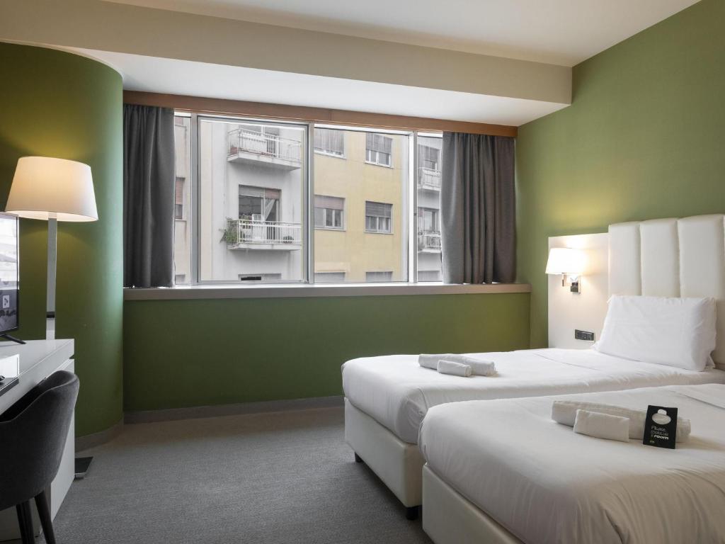 Posteľ alebo postele v izbe v ubytovaní B&B HOTEL Trapani Crystal