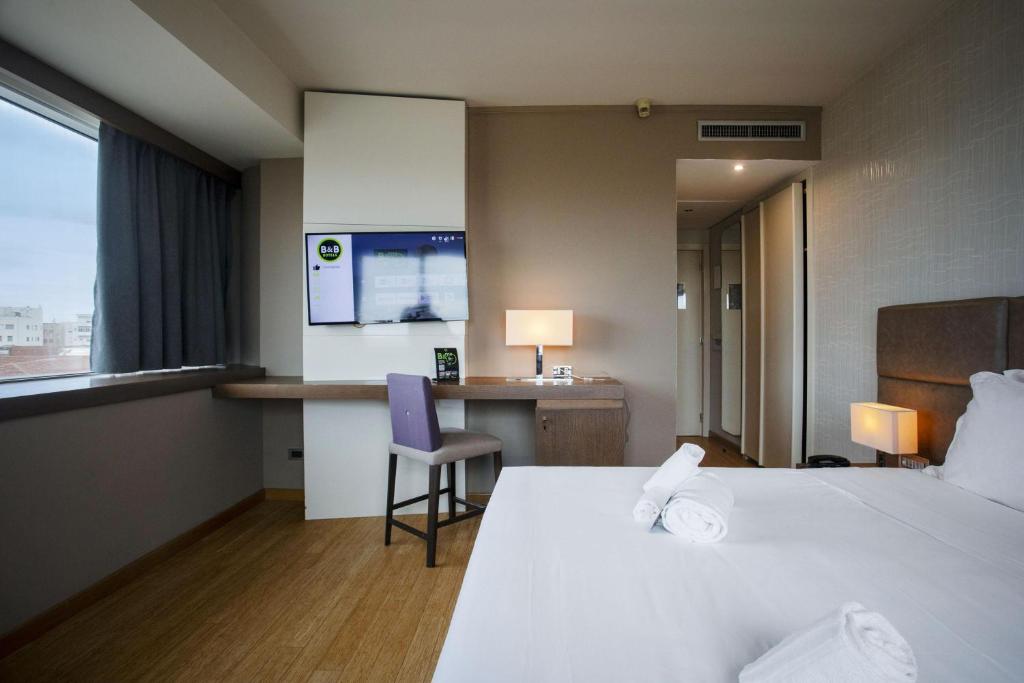 Posteľ alebo postele v izbe v ubytovaní B&B HOTEL Trapani Crystal