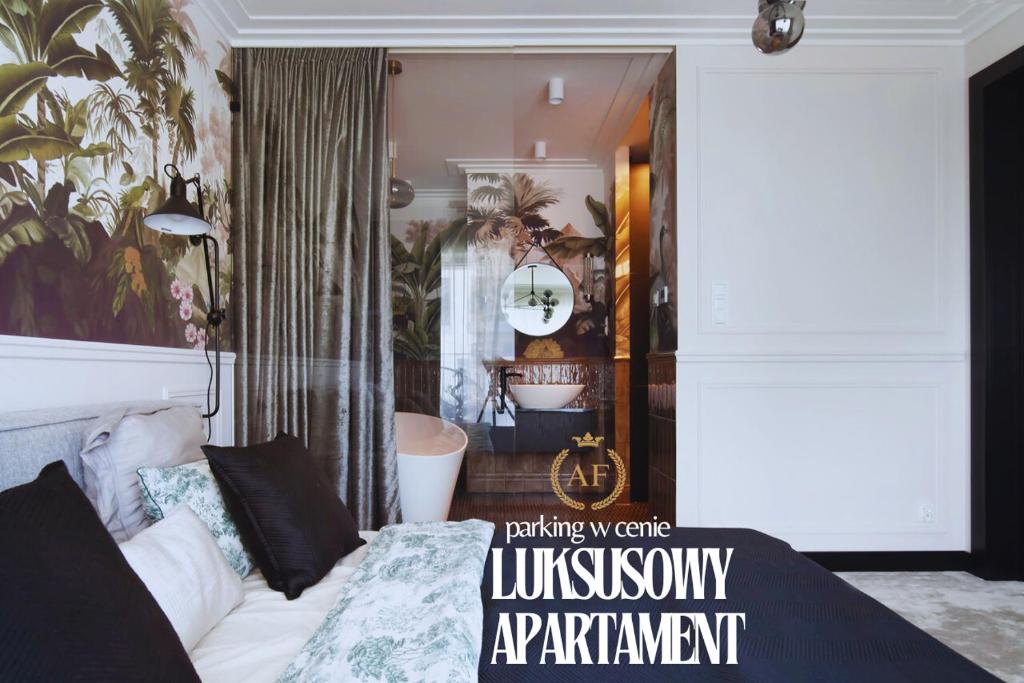 a living room with a couch and a bedroom at Apartament Faltom 6 Yacht Park Premium in Gdynia