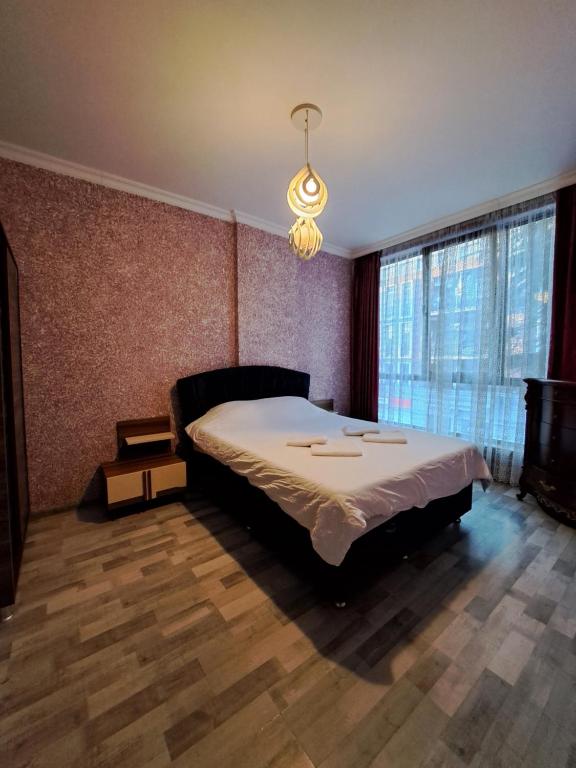 Postel nebo postele na pokoji v ubytování Karvi Hostel & Suites