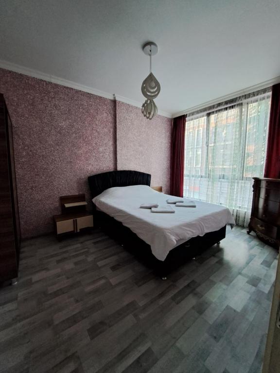 Postel nebo postele na pokoji v ubytování Karvi Hostel & Suites