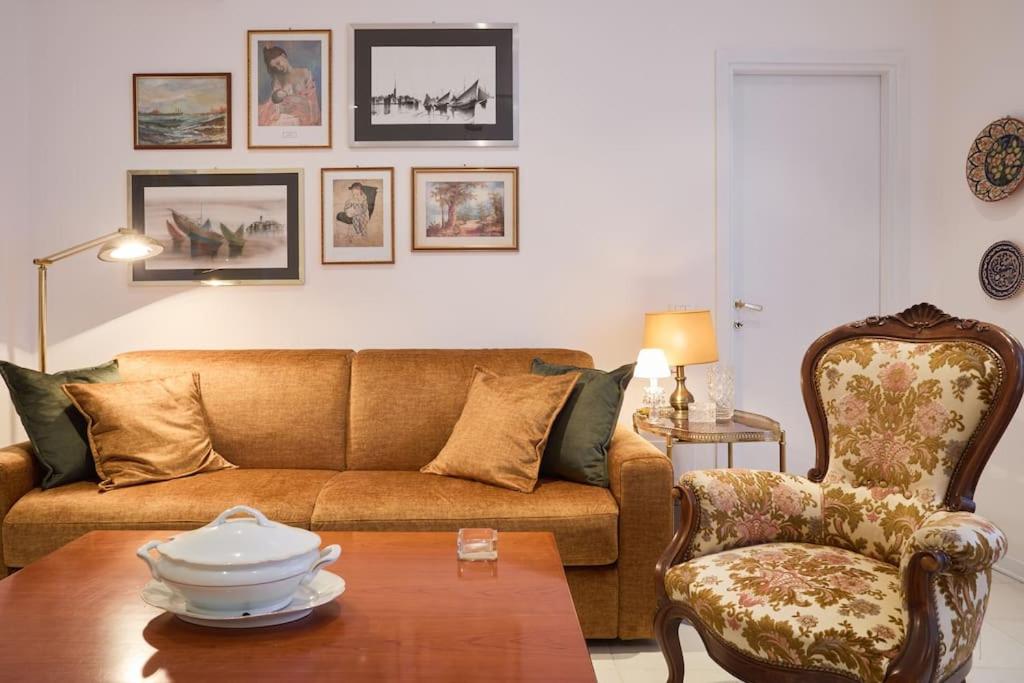 a living room with a couch and a chair at La casa di Visi in Milan