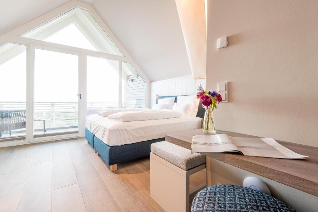 Un pat sau paturi într-o cameră la NEU! HAFEN27, No 10 - exklusiv urlauben mit Wattblick in List auf Sylt