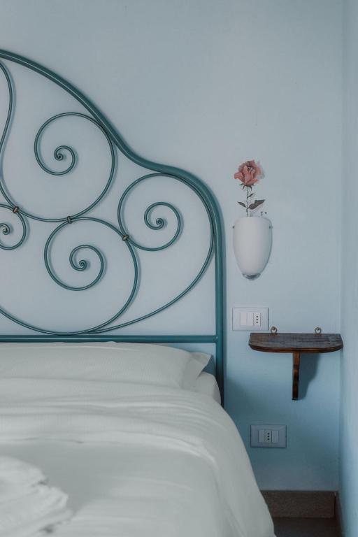 Postel nebo postele na pokoji v ubytování Guesthouse Giulietta e Romeo