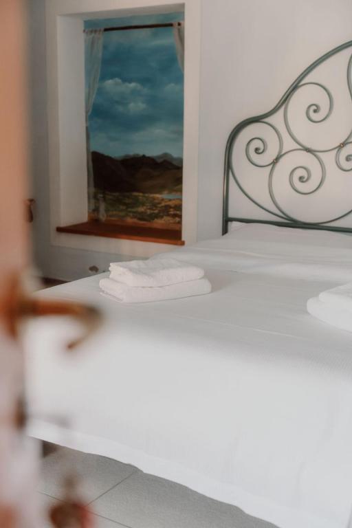 Postel nebo postele na pokoji v ubytování Guesthouse Giulietta e Romeo