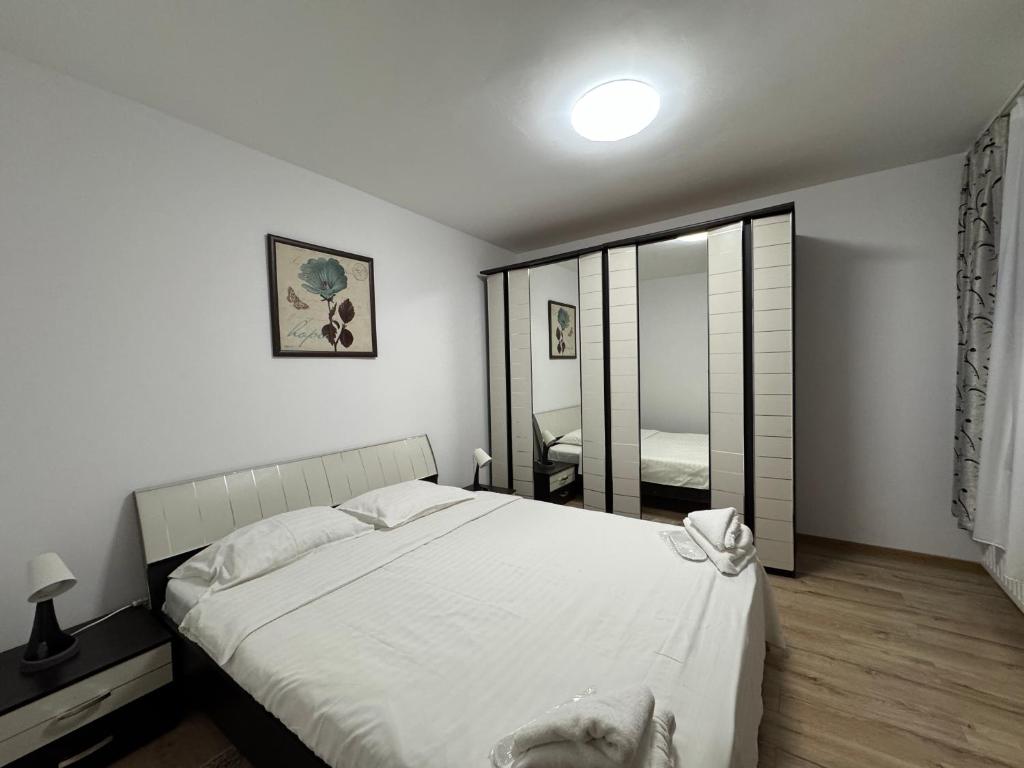 Postel nebo postele na pokoji v ubytování Monte Carlo Palace Suites