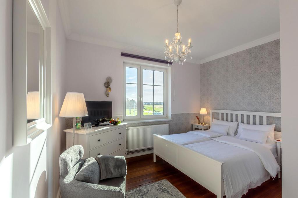 Postel nebo postele na pokoji v ubytování Hotel Villa Wahnfried Thiessow