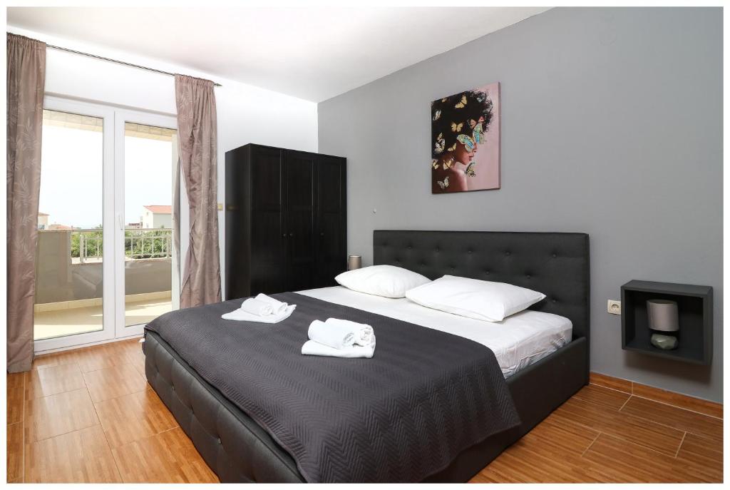 Postel nebo postele na pokoji v ubytování M&Z Apartmani