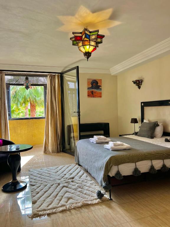 Postel nebo postele na pokoji v ubytování Le Rubis Oriental Marrakech
