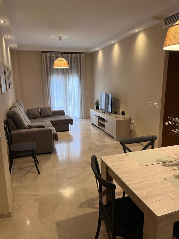 a living room with a couch and a table at Piso céntrico en zona monumental de Antequera in Antequera