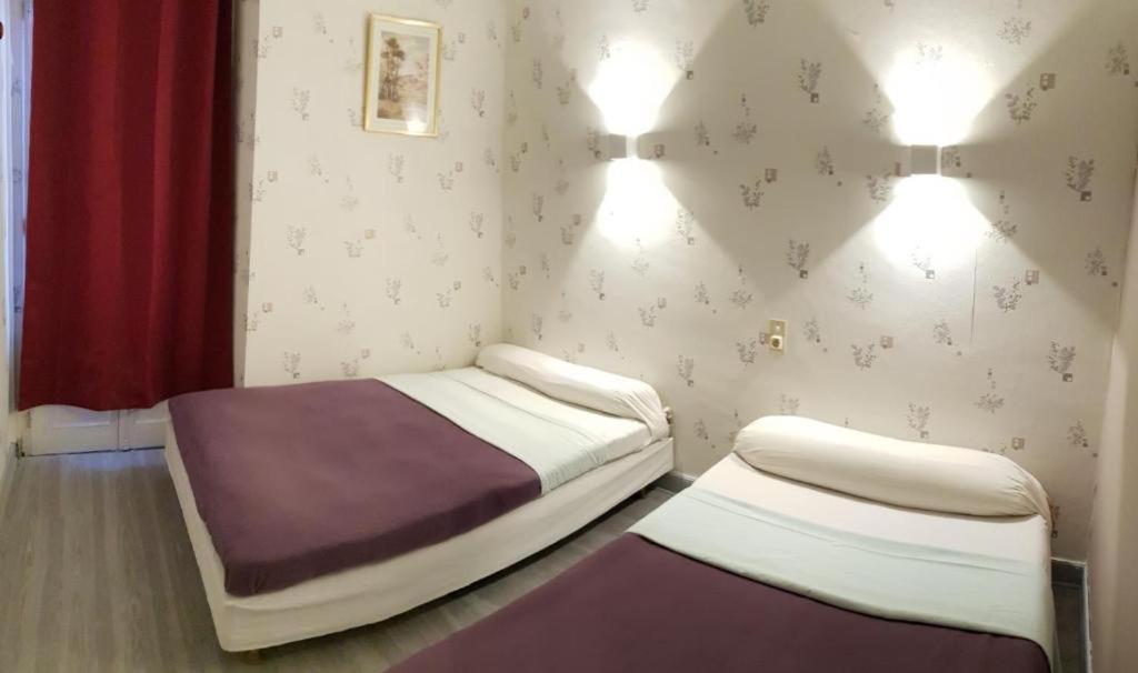 Postel nebo postele na pokoji v ubytování hotel saint fracois xavier