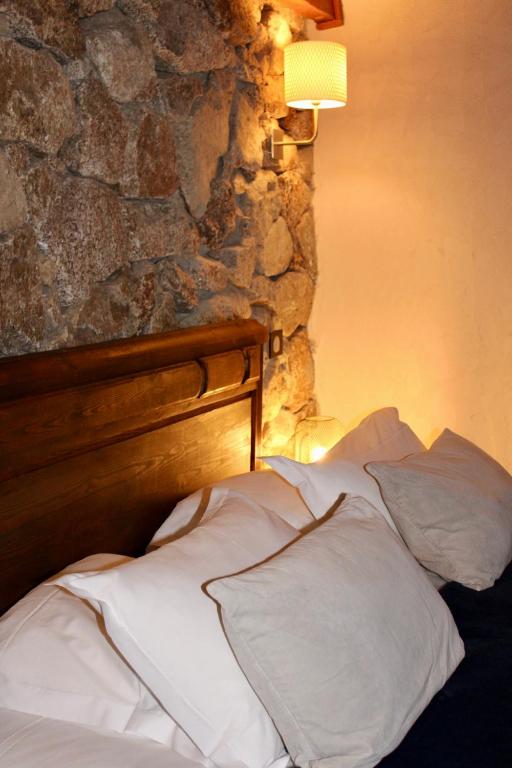 Postel nebo postele na pokoji v ubytování Bergerie du Prunelli