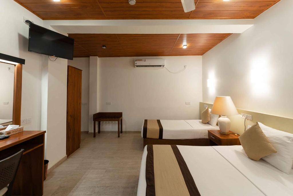 Postel nebo postele na pokoji v ubytování Beach Corridor Hotel & Spa with Free Airport shuttle
