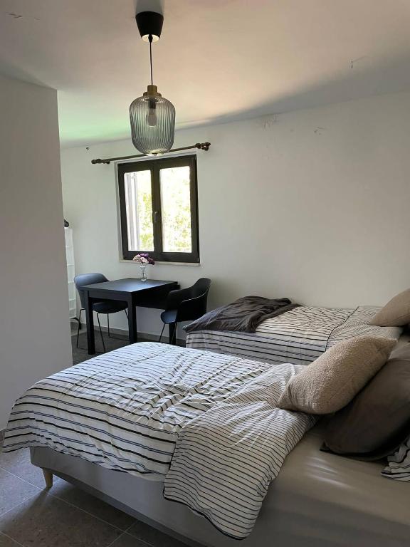 Postel nebo postele na pokoji v ubytování Villa L.L
