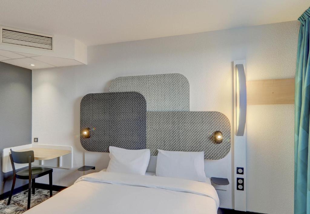 Postel nebo postele na pokoji v ubytování B&B HOTEL Montluçon Saint-Victor