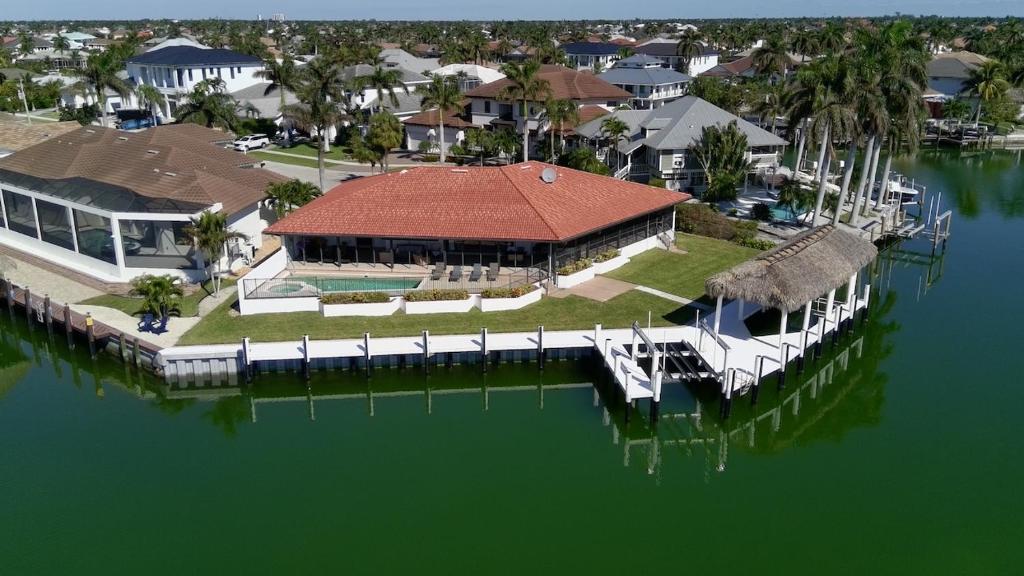 an aerial view of a house on the water at Waterfront Tip Lot Treasure w/ Southern Sunshine in Henry Key