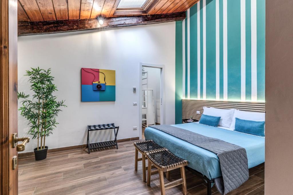 Hotel Luciana Vatican Apartment, a bedroom with a bed and a large window at Luciana Vatican Apartment in Rome