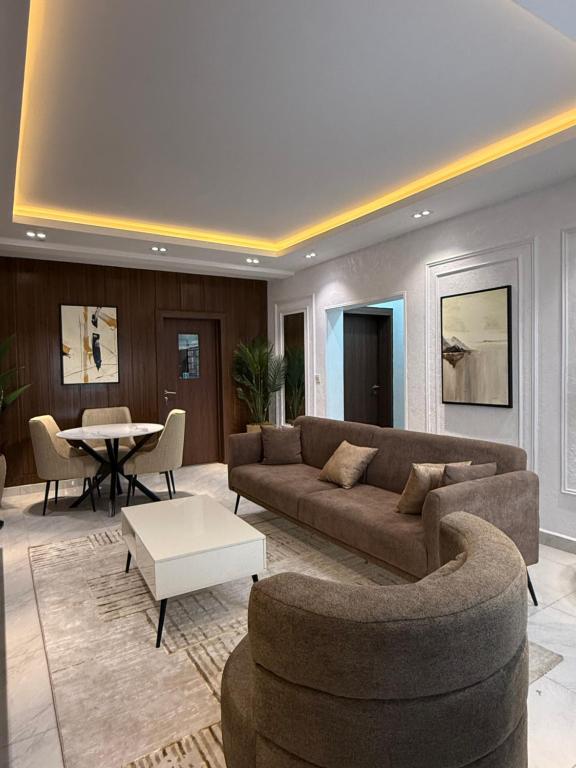 a living room with a couch and a table at Harolds Place in Lagos