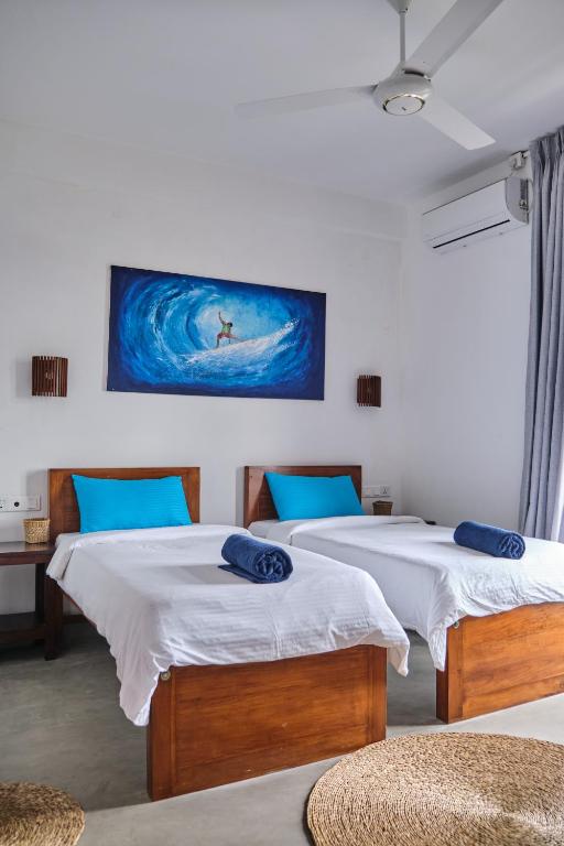Llit o llits en una habitació de RUMA Surf Hotel