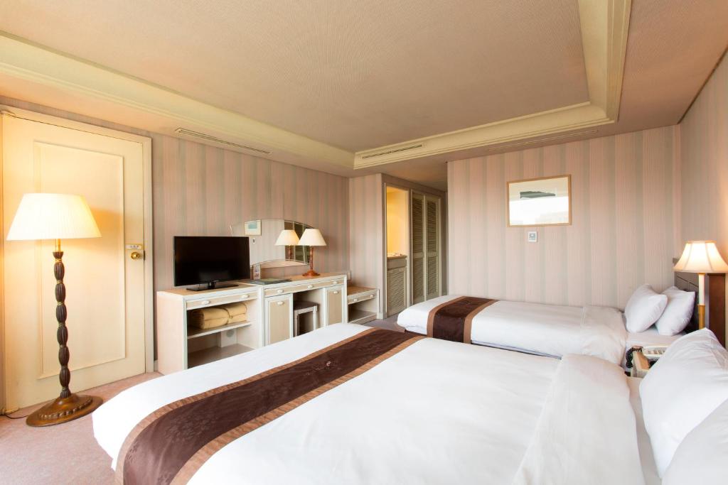 Postel nebo postele na pokoji v ubytování Libero Hotel