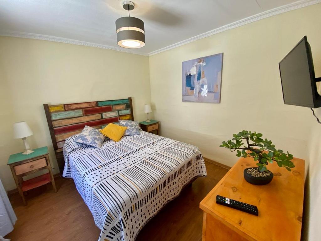 Voodi või voodid majutusasutuse El Arroyo Apart Hotel toas