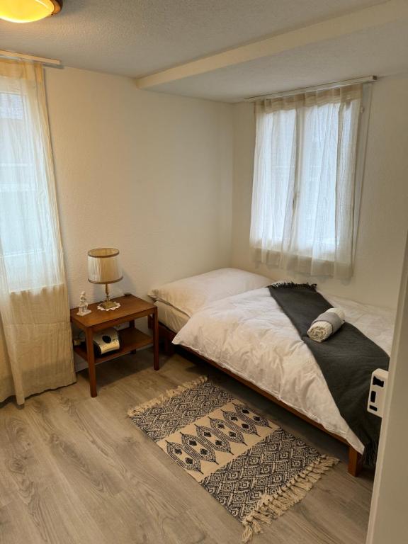 Postel nebo postele na pokoji v ubytování Bijou N 2 Lungern