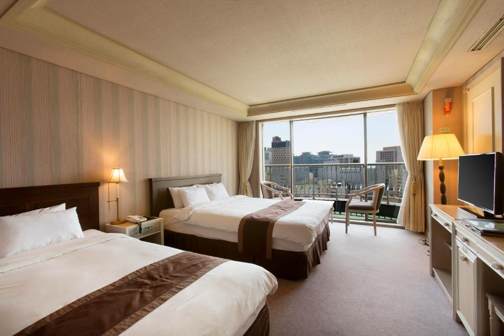 Postel nebo postele na pokoji v ubytování Libero Hotel