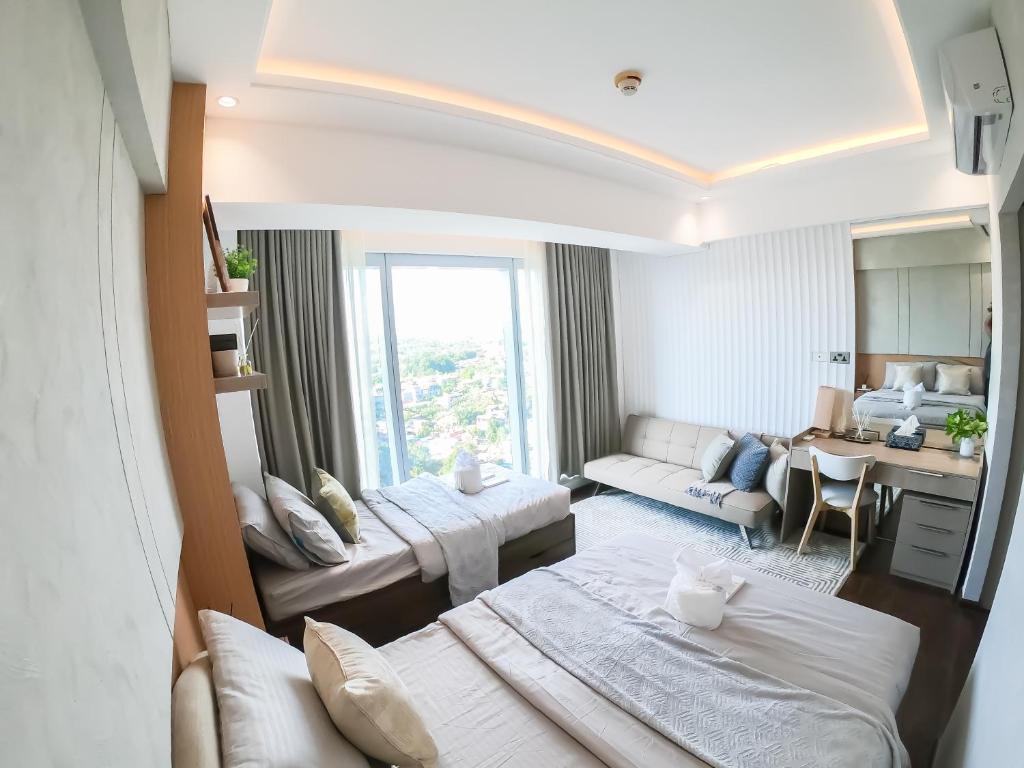Postel nebo postele na pokoji v ubytování 1 Bedroom Apartment in Aeon Towers I City Views I Free Wi-fi, Gym and Pool