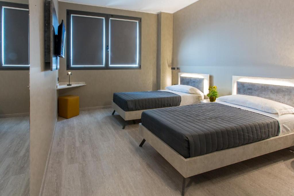 Postel nebo postele na pokoji v ubytování Break Hotel
