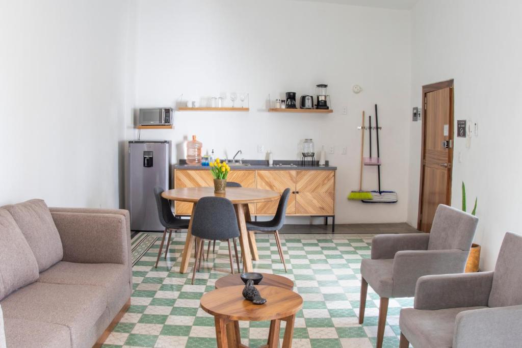 a living room with a couch and a table at Casa Monarcas - Victoria (with AC) in Guadalajara