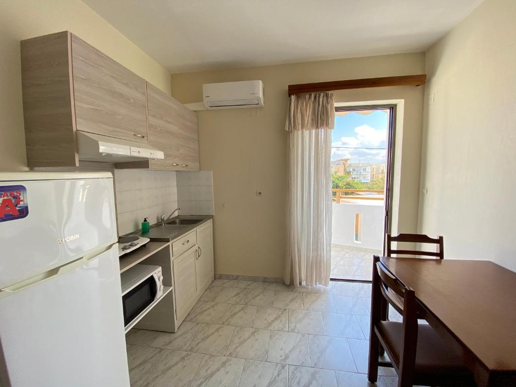 Kuchyňa alebo kuchynka v ubytovaní Domenica Apartments