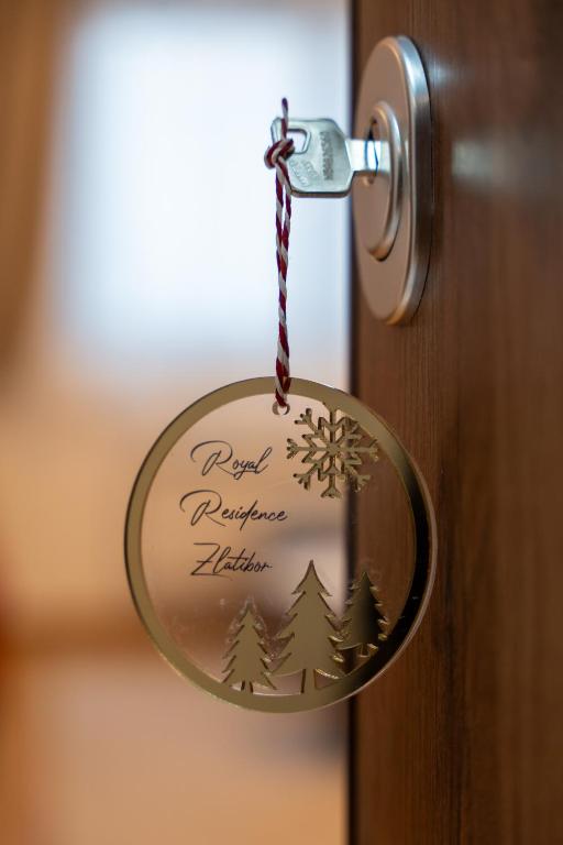 a christmas door ornament hanging from a door knob at Royal Residence Zlatibor in Zlatibor