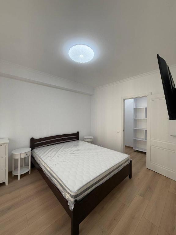 Postel nebo postele na pokoji v ubytování Inam Apart