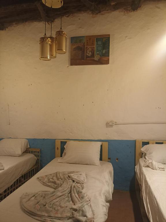 Postel nebo postele na pokoji v ubytování Bait Ward Nubian House