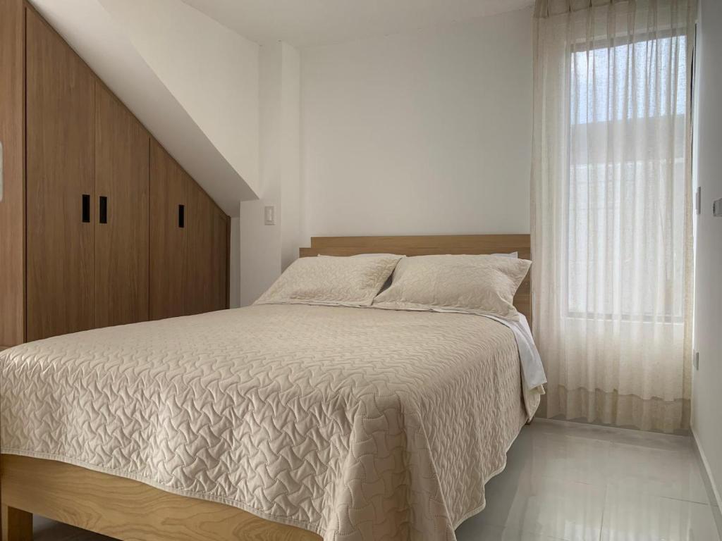 Postel nebo postele na pokoji v ubytování Suite Los Naranjos