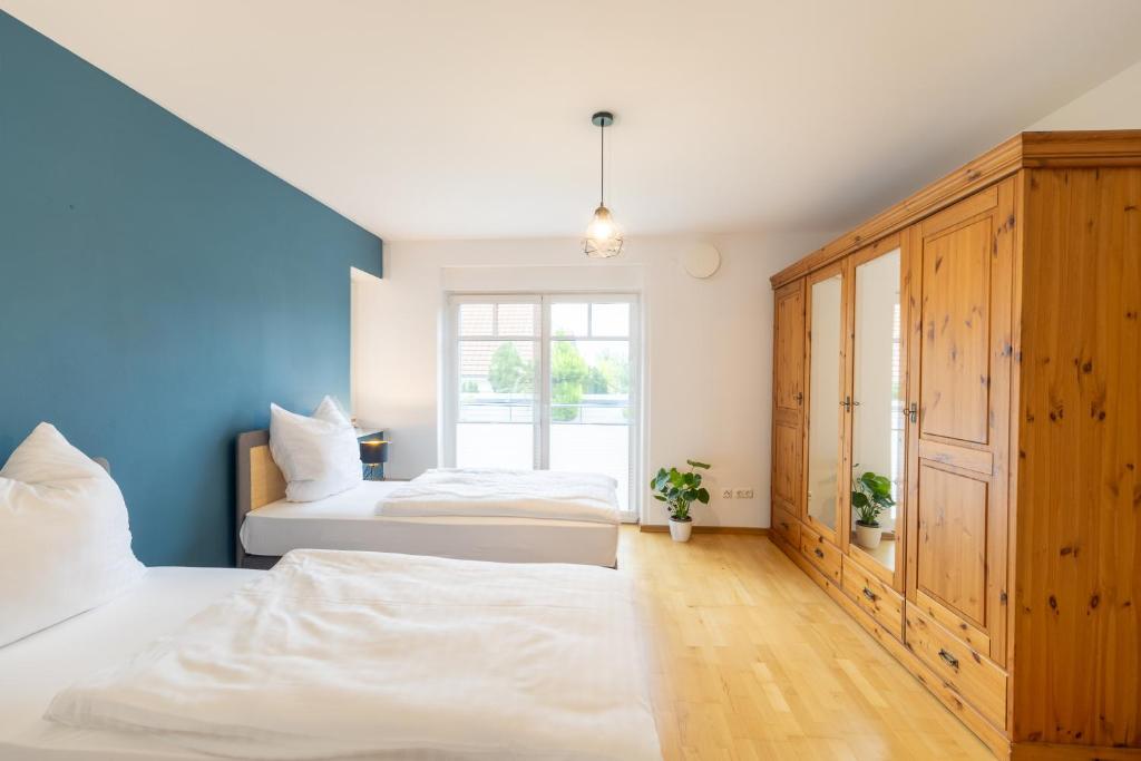 Voodi või voodid majutusasutuse Große Traumwohnung mit Garten toas