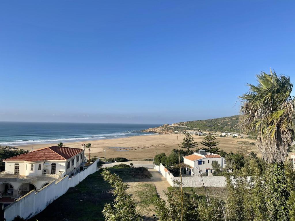 a view of the beach from a house at Villa familiale Achakkar 2 in Tangier
