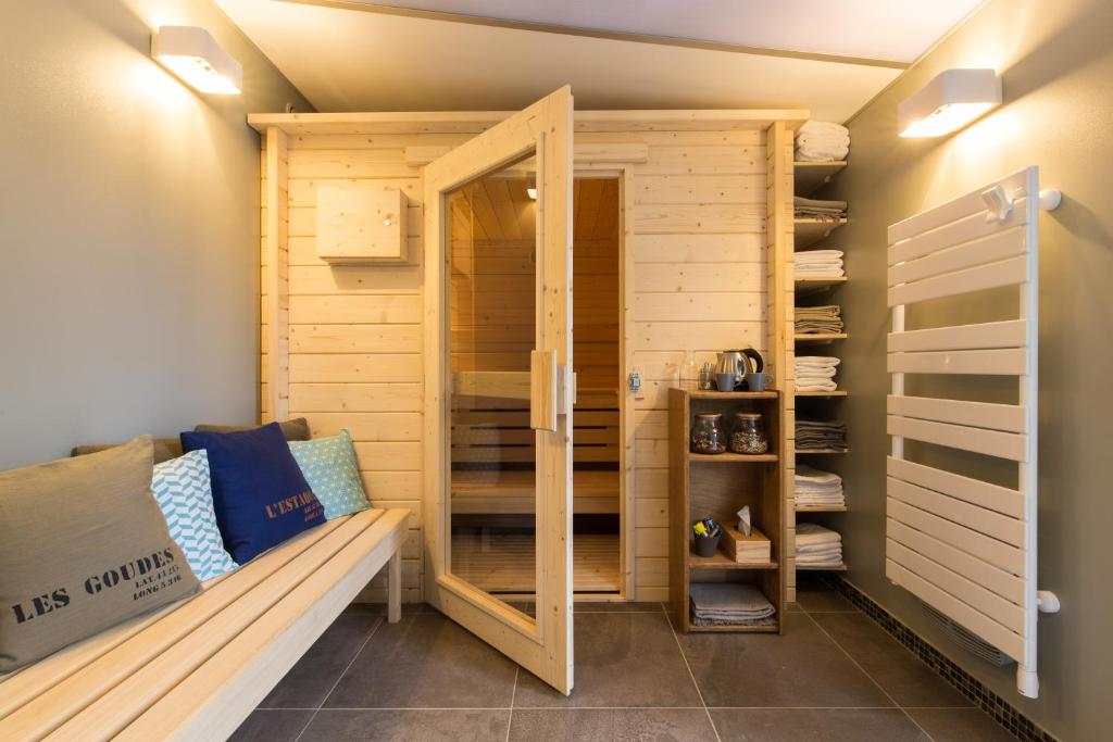 a sauna with a bench in a room at Hôtel 96 in Marseille