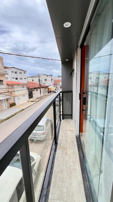 a balcony of a building with a view of a city at CASARÃO SUíTES MARAGOGI in Maragogi