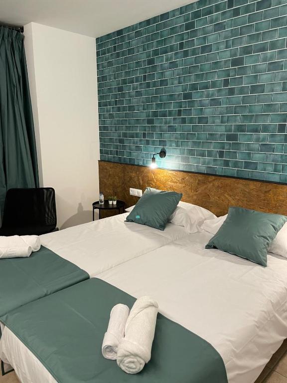 Postel nebo postele na pokoji v ubytování HOTEL ORENETA - Gironella
