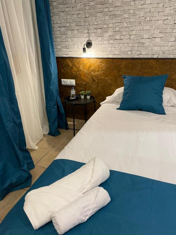 Postel nebo postele na pokoji v ubytování HOTEL ORENETA - Gironella